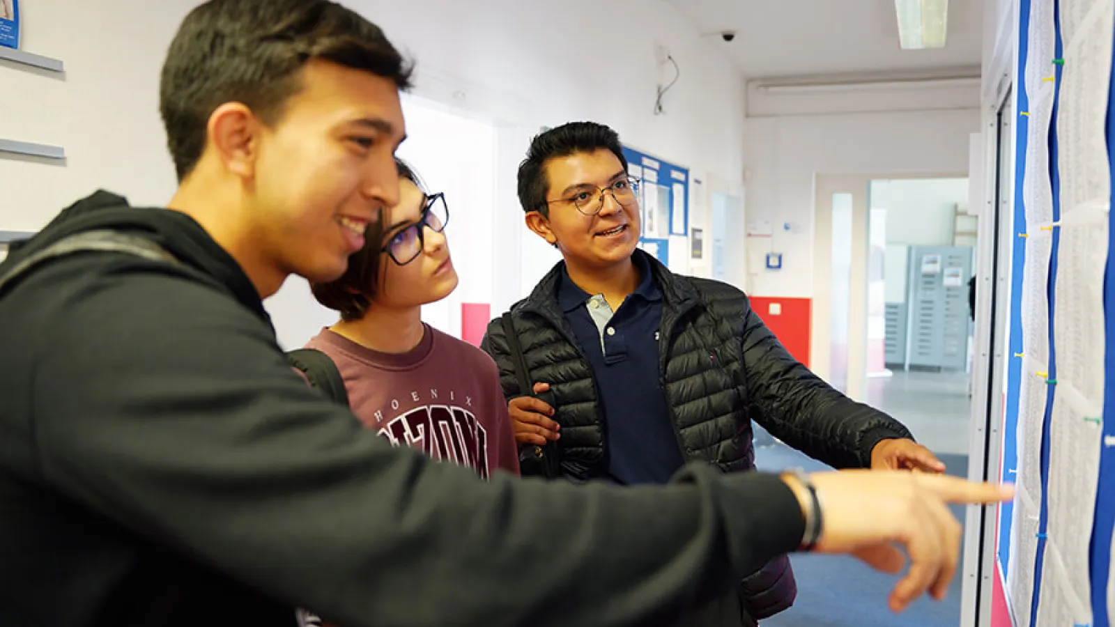 Alpadia students looking at a board in the school